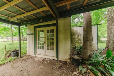 View of outbuilding with french doors