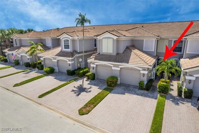 View of front facade featuring a tile roof, drivew