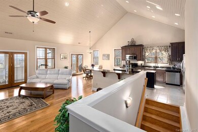 Open concept living with natural lighting that bri