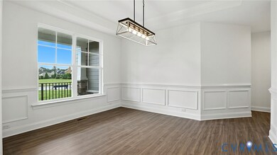 As you enter, you'll be greeted by a formal dining room w/ tray ceiling and a home office with glass French doors located directly off the foyer. 
