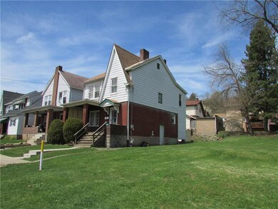 Four bedroom home for sale.  Includes vacant lot.  Great Yard!!