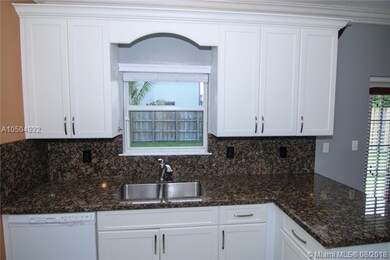 Kitchen. View to the backyard. Cabinets and Dishwa