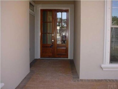 8' wood and glass front door welcomes you home. Front door and all exterior openings, including windows, have hurricane protections devices that can easily be installed. Save on insurance!