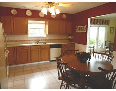 Kitchen. Beautiful cabinets, backsplash and chair 