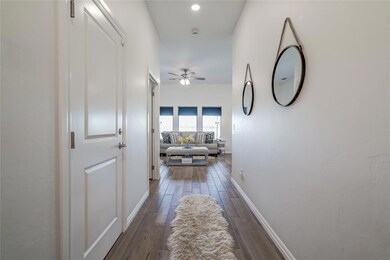 Corridor with dark hardwood / wood-style floors