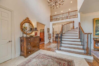 The grand entrance has the spiral staircase as its centerpiece.  The parlor is to the left of the foyer and the formal dining room to the right.