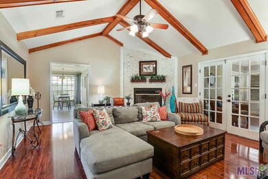 Vaulted Beamed Ceilings, fireplace,  French Doors 