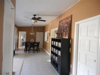 Ceramic tile from front entry (to right) through dining area; Formal living to left and family room to right; kitchen to left of dining space; Ceiling fans throughout