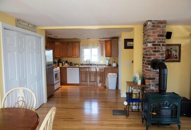 Kitchen showing gas stove in Living Room