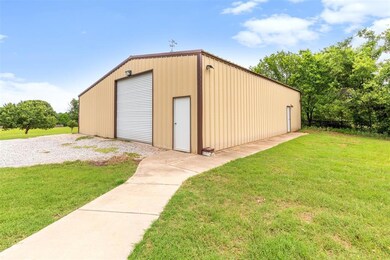 30 x 50' Morton shop with 110v and 220v electricity and 12' overhead door. The 30x30' space is pictured.   A 30' x 20' space in back was divided into family lrecreation space and is easily converted back.
