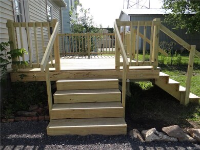 The deck has access from the driveway or back yard.