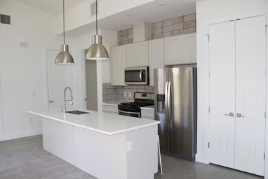 Kitchen with a sink, decorative backsplash, finis