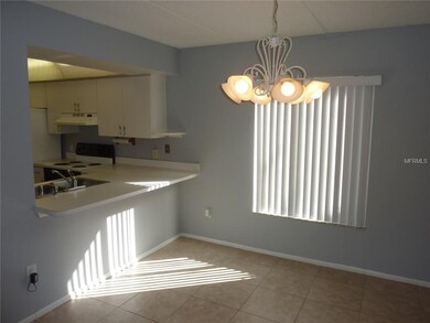 Dining area with kitchen pass-thru.