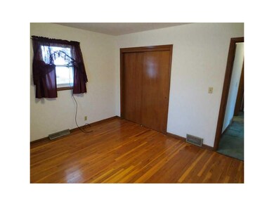 Bedroom. Nice hardwood floors in one of the two be