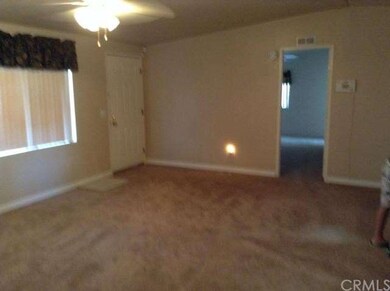 Living room with door to Master Bedroom