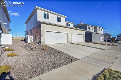 View of property exterior featuring a garage