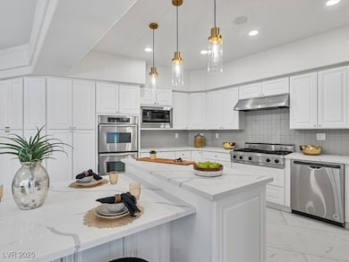 Kitchen featuring appliances with stainless steel