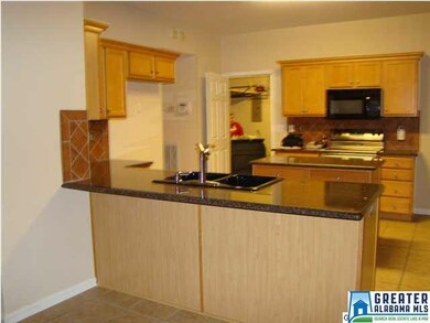 Another view of the kitchen and the door to garage