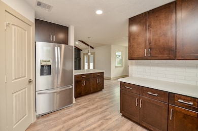 Kitchen has been updated with new cabinets, counte