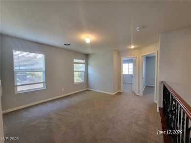 Empty room with a smoke detector, plenty of natura