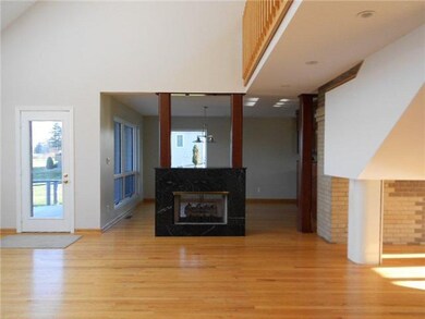 Living Room. A double sided gas fireplace separate