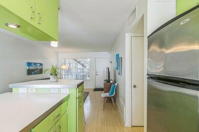 Kitchen featuring freestanding refrigerator, gree