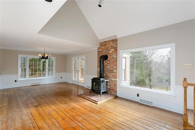 Great room with vaulted ceiling open to nook