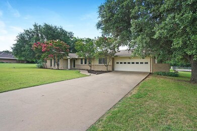 View of front of property featuring a front lawn a