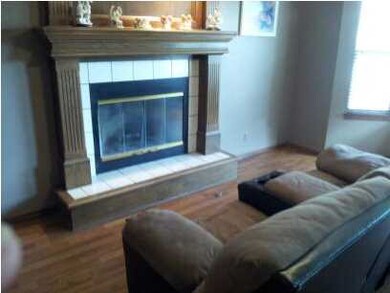 LIVING ROOM W/ FIREPLACE AND BAY WINDOW