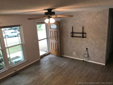 Open living area with streaming natural light, rea