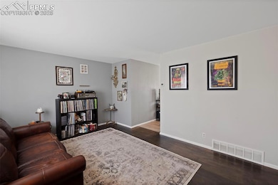 The main level boasts beautiful hardwood floors, three well-sized bedrooms, a full bath with a walk-in tub, and a spacious family room.