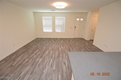 Unfurnished living room with wood finished floors