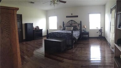 This split floorplan features a spacious master bedroom suite just steps from the private screened porch and in-ground pool