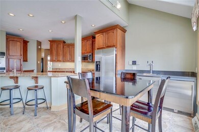 Another view of the kitchen includes the island wi