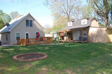 Lovely back yard with deck and outbuilding for sto