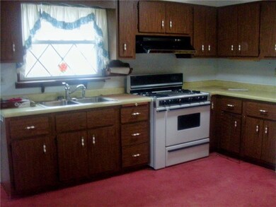 KITCHEN WITH WINDOW OVERLOOKING REAR YARD