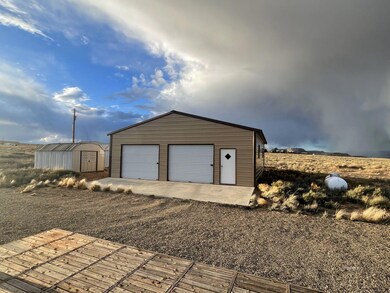 Garage w /2, 7' Rollups & 2 access doors