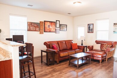 Living room with dark hardwood / wood-style floori