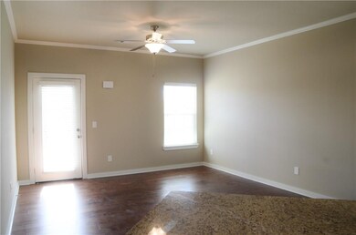Living Room - Hardwood floors, crown molding, ceiling fan and blinds. Still time to pick your colors! *pictures are not of actual home but similar colors may vary