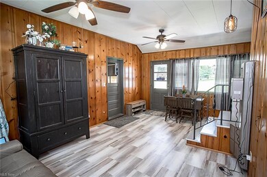 Spacious breezeway with newer windows and flooring
