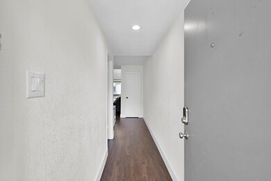 A bright and long formal entry leads you into your