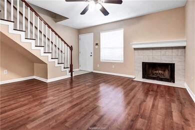 Unfurnished living room with ceiling fan, wood fin
