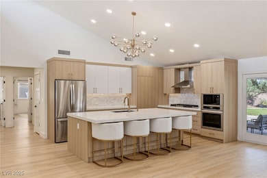 Kitchen featuring stainless steel appliances, a si