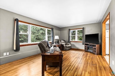 Living area featuring hardwood / wood-style flooring