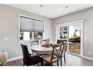 The dinette is nicely sized and covered in natural light. The home under construction will have a sunroom located off the dinette. Photo of model home, colors and finishes will vary.