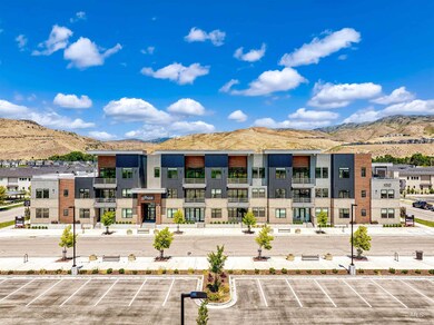 View of property featuring a mountain view and uncovered parking