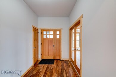 Front entry with coat closet and door way to extra