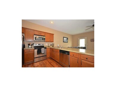 WALK-OUT TO BACK PATIO OFF KITCHEN/LIVING ROOM.