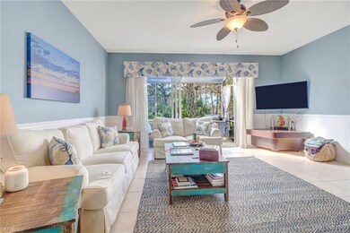 Family room with large sliders to screened lanai &