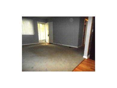 Living Room with newer carpet. Hardwood under carp